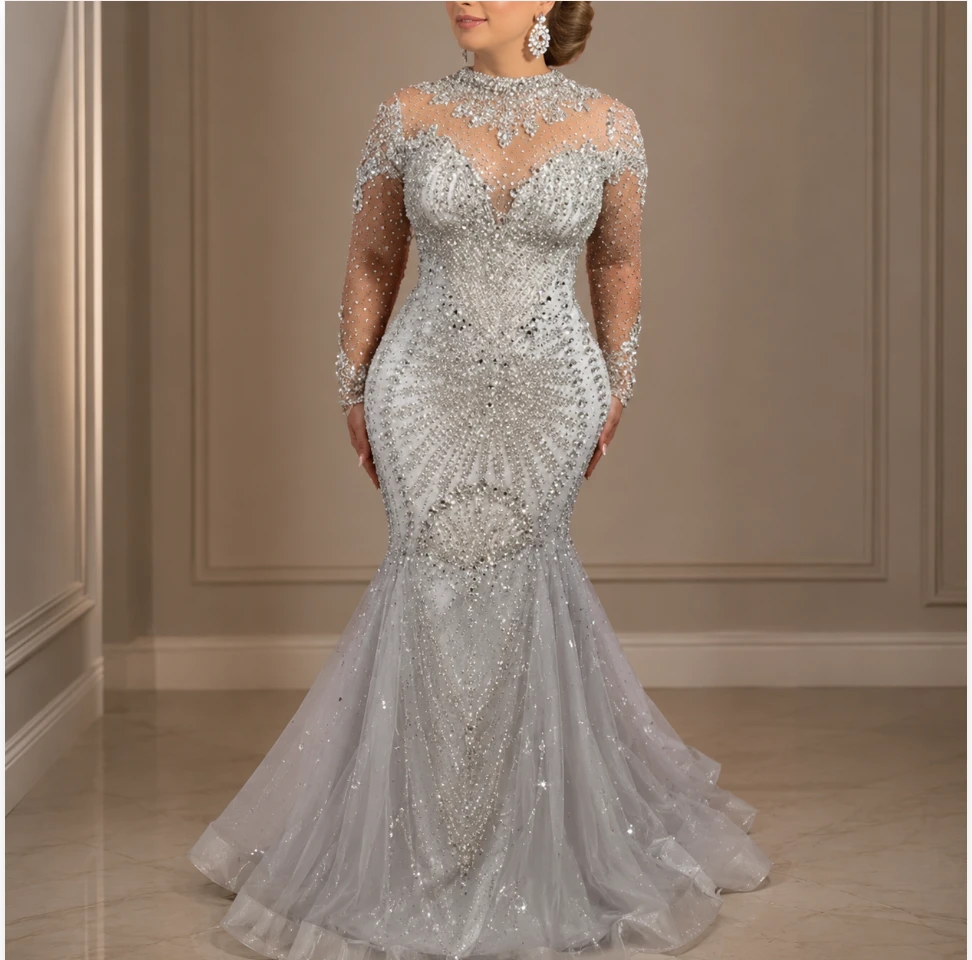 Crystal-beaded mermaid bridal gown with illusion sleeves, fitted in Columbus, Ohio